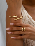 Two-piece set: elegant open asymmetrical bracelet with intersecting water droplets and antique gold ring