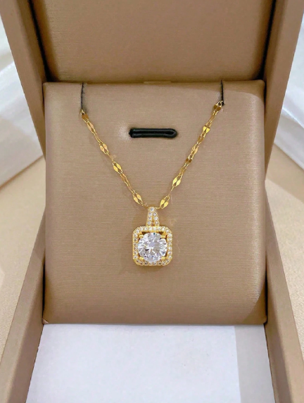 A copper chain, necklace, and earrings set inlaid with fine copper inclusions.