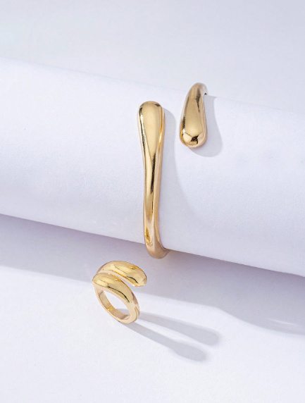 Two-piece set: elegant open asymmetrical bracelet with intersecting water droplets and antique gold ring
